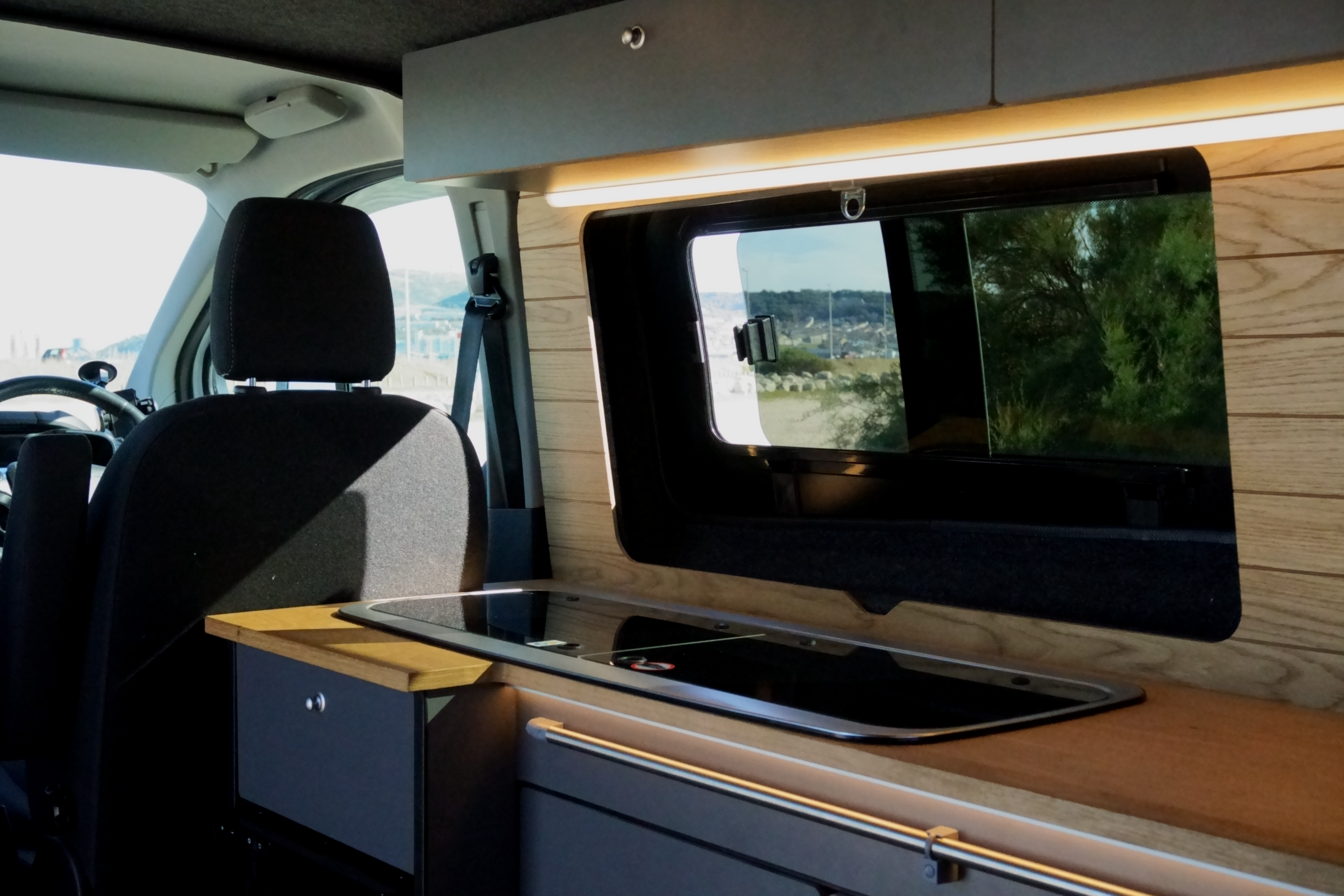 Coastal Weekender campervan kitchenette and fold-out table